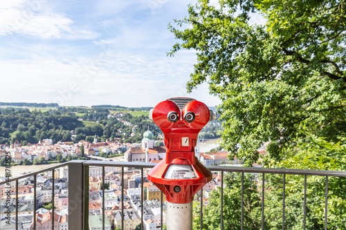 Fototapeta Naklejka Na Ścianę i Meble -  Binoculars at a viewpoint at the old town of Passau, bavaria