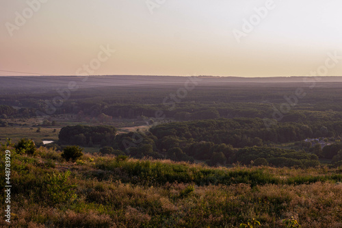 Panorama overlooking the city from the mountain at sunset. Ukraine, city of Izium August 2, 2021