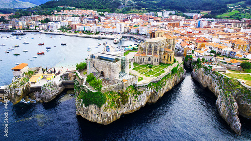 In this imagen you can see Castro Urdiales, its port, its cliff, and its buildings- All of this is ubicated in Cantabric see, in Cantabria, Spain.  photo