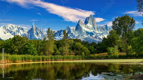 A body of water with a mountain in the background