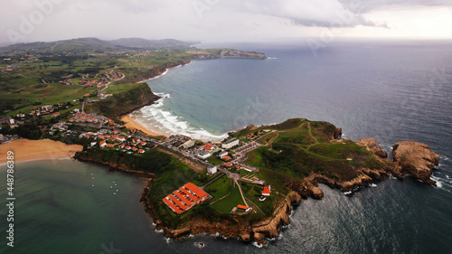 In this imagen you can see Locos Beach in Suances, Cantabria, Spain. Furthermore you can see the cliffs of this town. This town is the paradise of the surfers.  photo