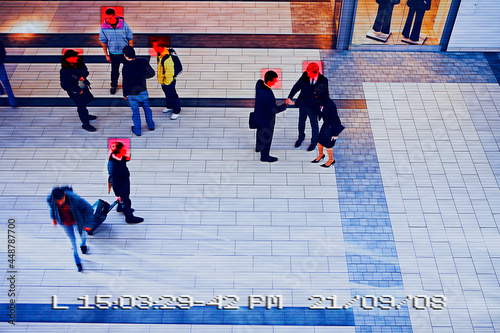 Security camera image of people in public building