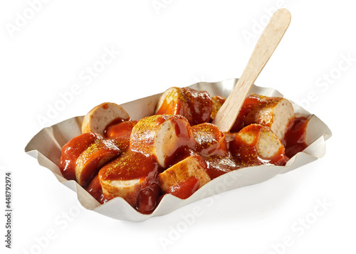 Fried sausage chunks with curry ketchup in container to go