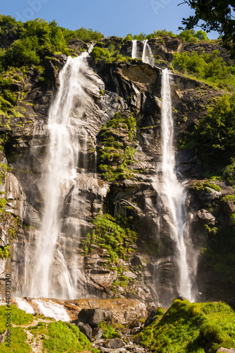Beautiful Acquafraggia waterfall in Piuro, in the Bregaglia valley in Italy, before the ascent to the Maloja pass. It is a beautiful sunny summer day