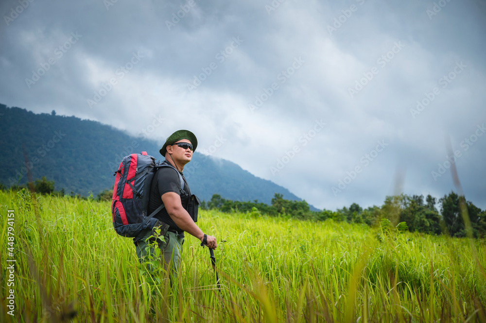 Backpacker trekking to study nature of tropical forest for ecotourism. Tourist trekking to see the beauty of the tropical forest in Khao Yai National Park. UNESCO World Heritage Area, Unseen Thailand. Backpacker trekking to study nature of tropical forest for ecotourism. Tourist trekking to see the beauty of the tropical forest in Khao Yai National Park. UNESCO World Heritage Area, Unseen Thailand.