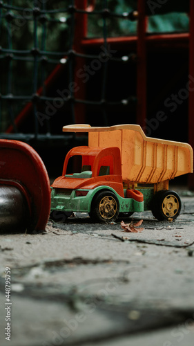 Toy truck on the playground after the rain