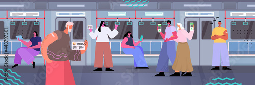 passenger in subway train using digital immunity passports on smartphone screens risk free covid-19 pcr certificate