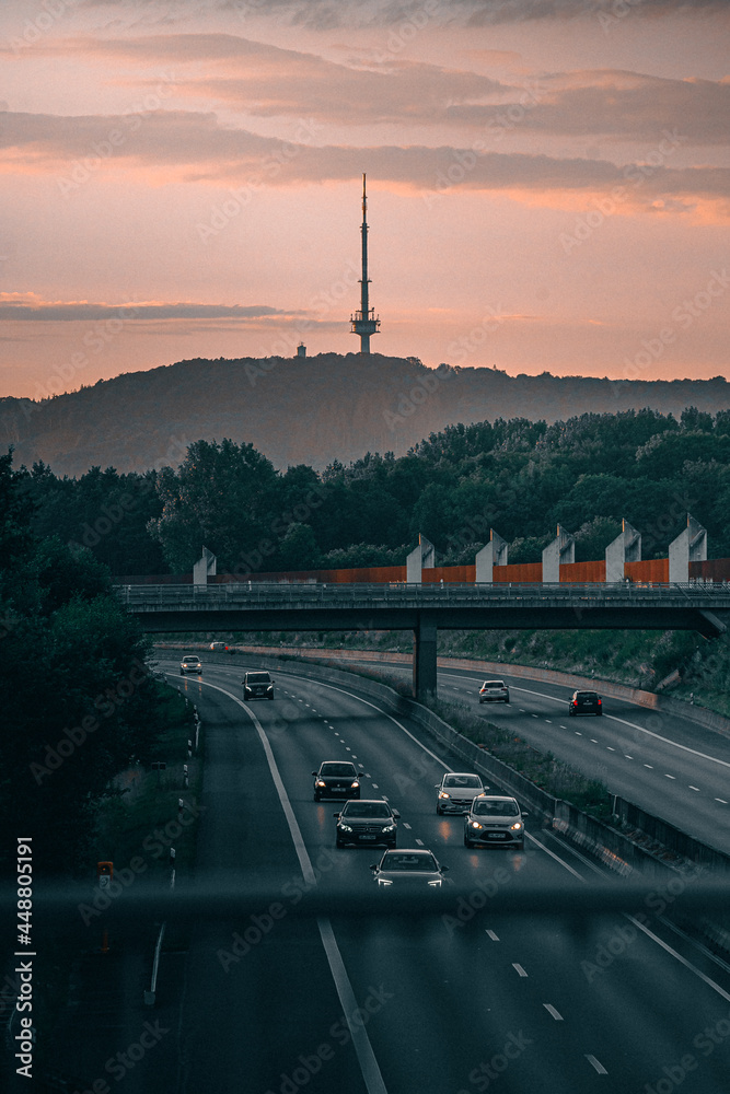 German Autobahn A2 At Sunset With Cars And The Bielefeld Television