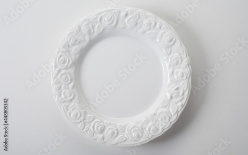 White plate with raised pattern