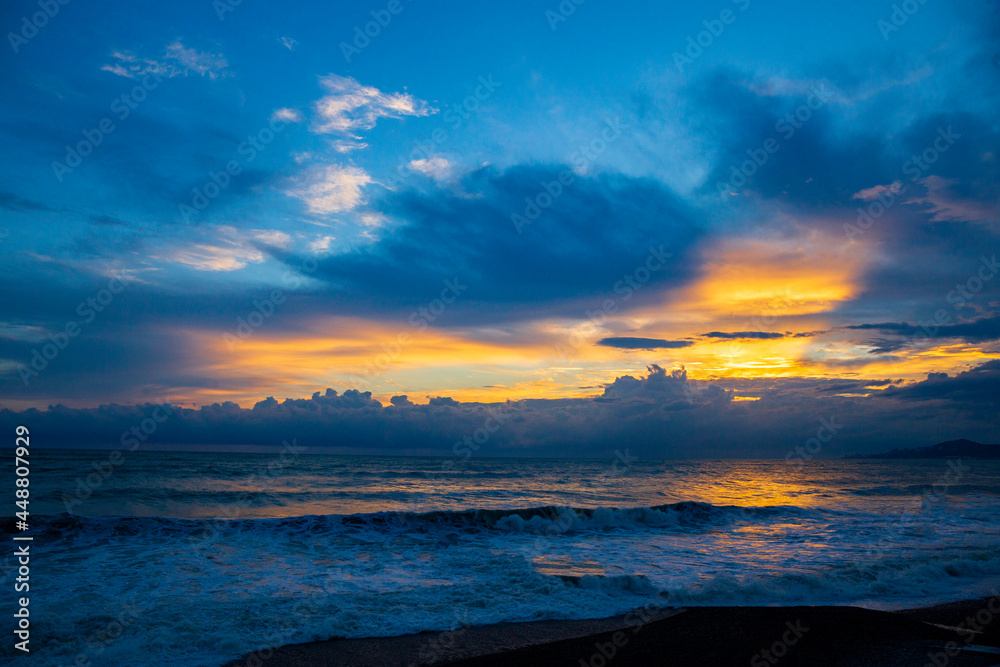 Fototapeta premium Beautiful sunset over the sea during a storm