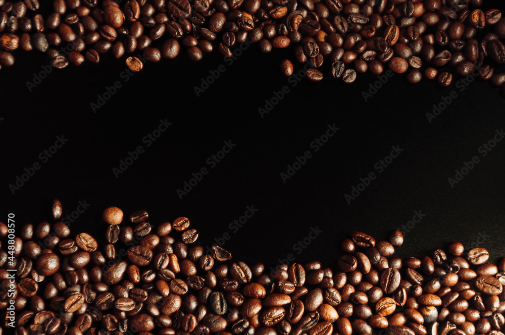 coffee beans flat lay on a wooden table on a black background. low key. Copy space. Mockup