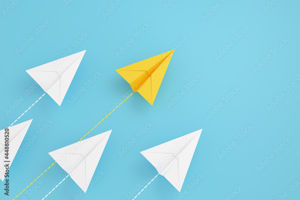paper planes on aline and one is leading, isolated on blue background, concept teamwork, leadership and management. paper planes on aline and one is leading, isolated on blue background, concept teamwork, leadership and management.