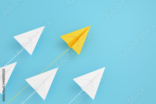  paper planes on aline and one is leading, isolated on blue background, concept teamwork, leadership and management.