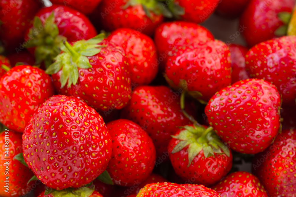 Fresh red ripe organic strawberry background. Healthy vegan food. Fresh red ripe organic strawberry background. Healthy vegan food.