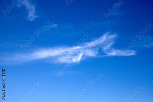 Light blue clouds on the blue sky.