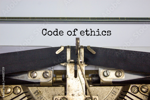 Code of ethics symbol. Words 'Code of ethics' typed on retro typewriter. Business, Code of ethics concept. Copy space.