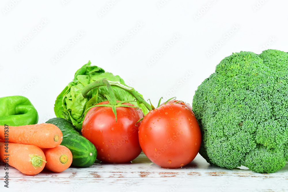 Assortment of fresh vegetables on white background, essential for good health. Assortment of fresh vegetables on white background, essential for good health.