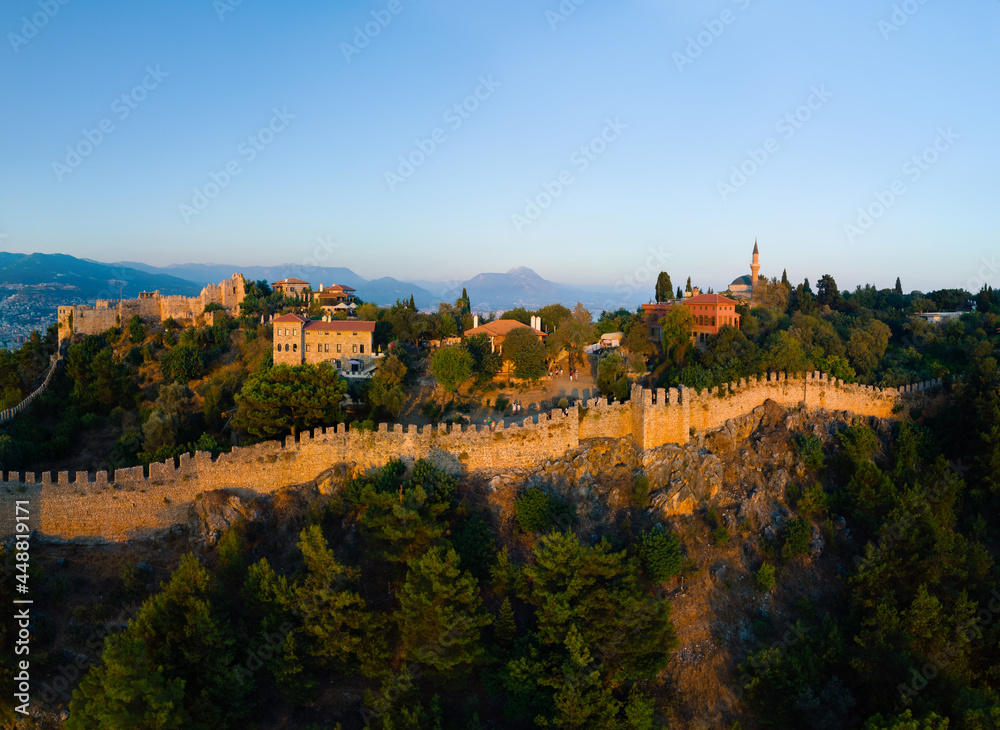 Large panorama. Wide aerial view of Alanya in southern coast of Turkey, Summer sunset. Travel and vacation. Kalesi Castle. an ancient fortification. defensive walls