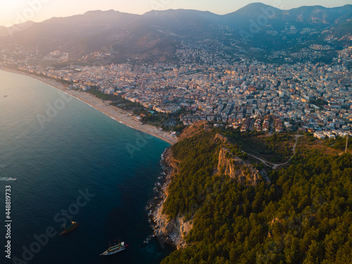 Aerial view of Kleopatra beach, lake. Alanya in southern coast of Turkey, Summer day. Travel and vacation. Kalesi Castle. Mountain. Ships and boats in the mediterranean © Sergey