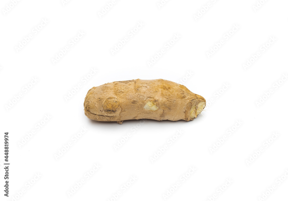 A piece of organic ginger on isolated white background
