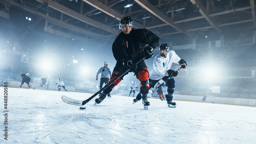 Ice Hockey Rink Arena: Professional Forward Player Masterfully Dribbles, Breaks Defense, Gives Perfect Pass and Riding On Camera. Strong Performance Teams Play. - obrazy, fototapety, plakaty 