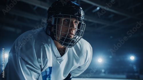Photography Ice Hockey Rink Arena: Confident Professional Player Ready for Faceoff and Match Start
