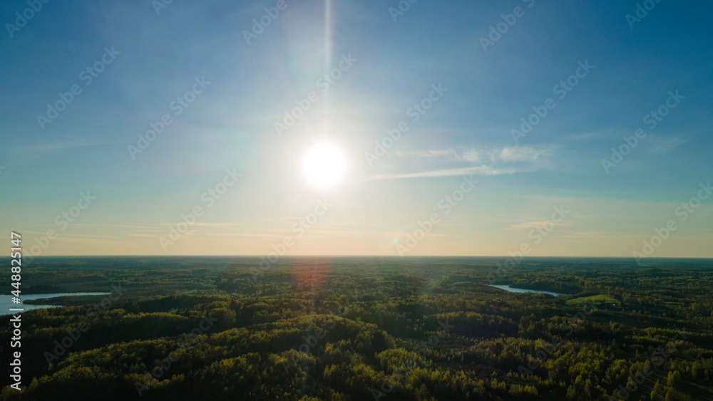 High altitude aerial view of the sun and clear blue sky. Beautiful nature background. Space for text.