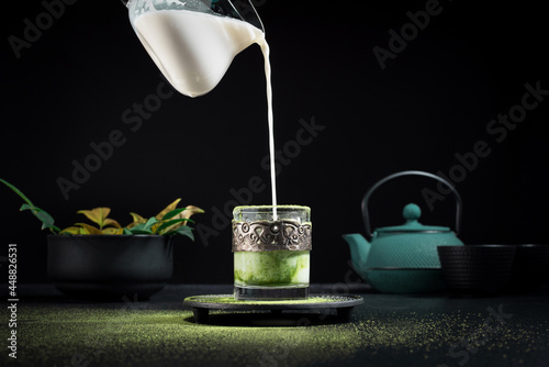 Serving matcha tea with milk photo