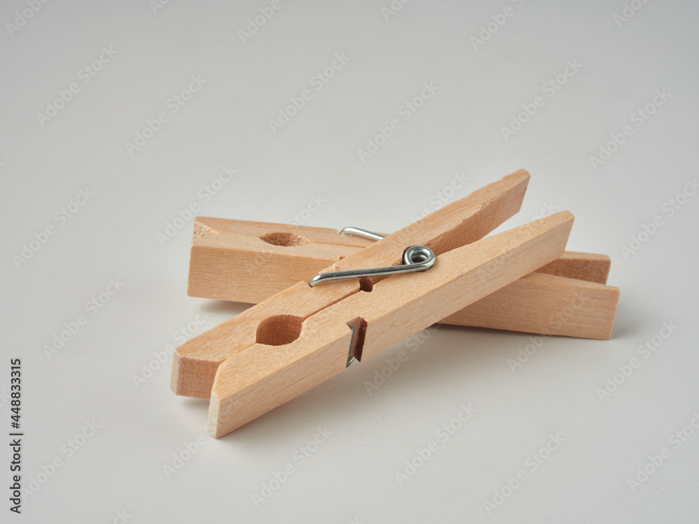 Set of wooden clothes pins on white background