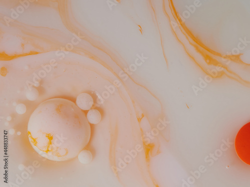Colorful orange and white bubbles wallpaper theme background. The concept of a multicolored cosmic universe. Fantastic hypnotic surface. Abstract pattern Chemical Reaction Texture Liquid paint Bubble 