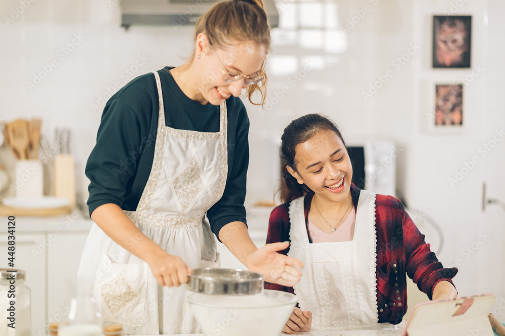 two Female Baker make Cupcakes in chitcken two Female Baker make Cupcakes in chitcken