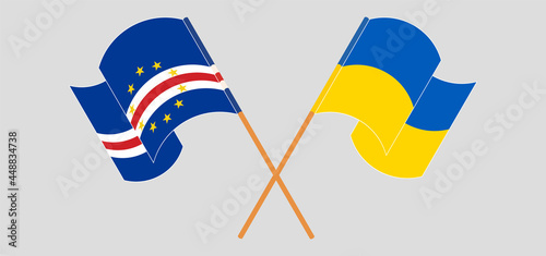 Crossed and waving flags of Cape Verde and Ukraine