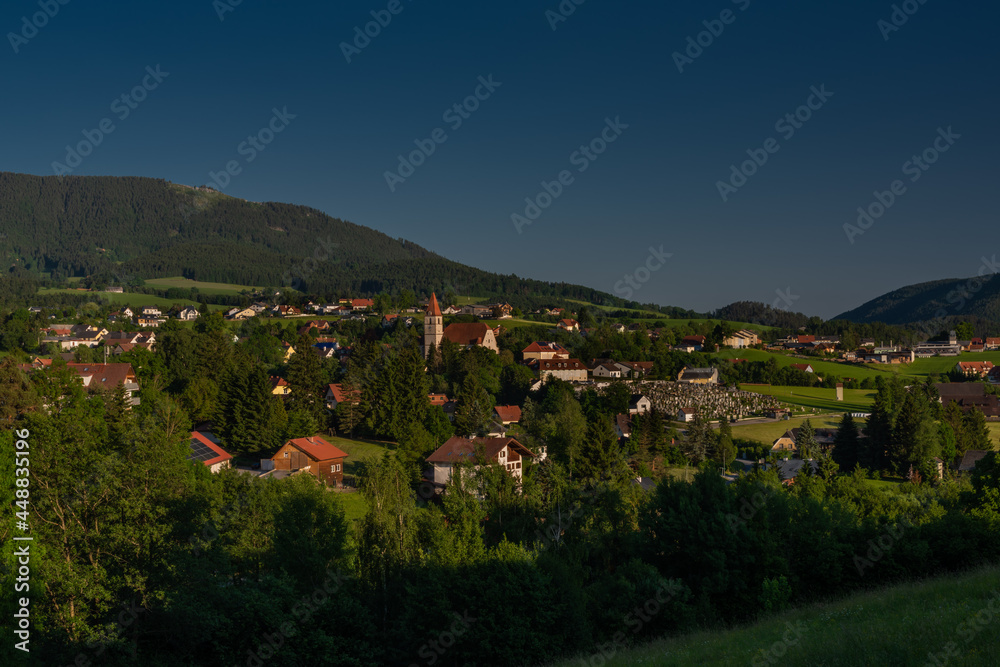 Semriach village with Schockl hill over in sunset sunny evening