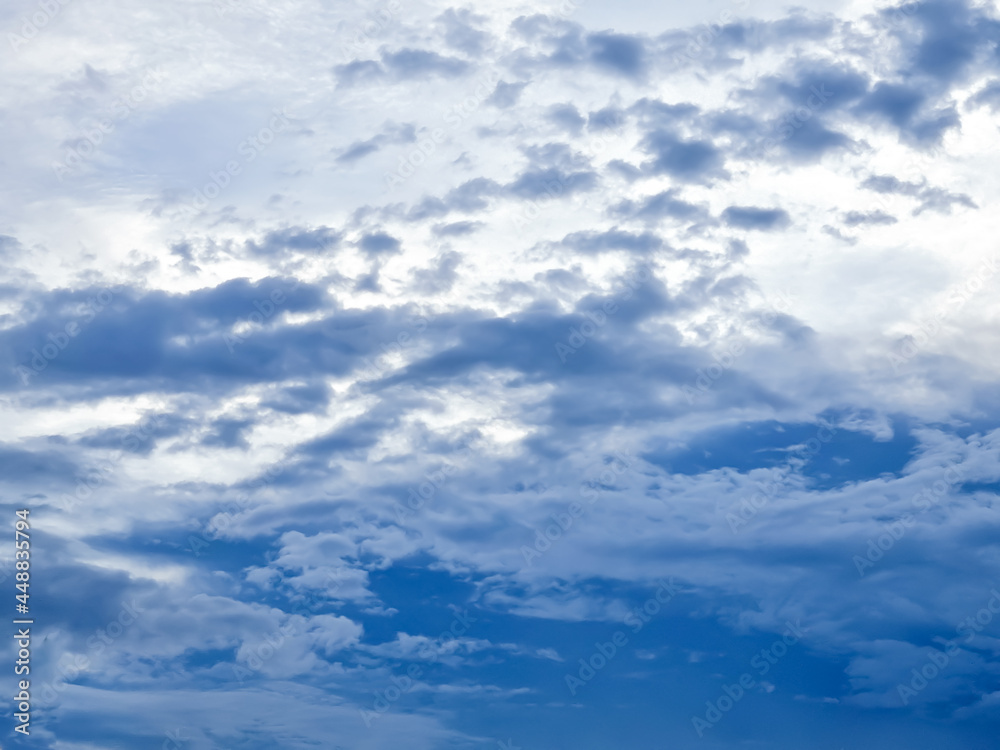 Blue sky on the evening, The evening sky photo, the sky was light blue with some white clouds, not much light because the sun had already set Blue sky on the evening, The evening sky photo, the sky was light blue with some white clouds, not much light because the sun had already set