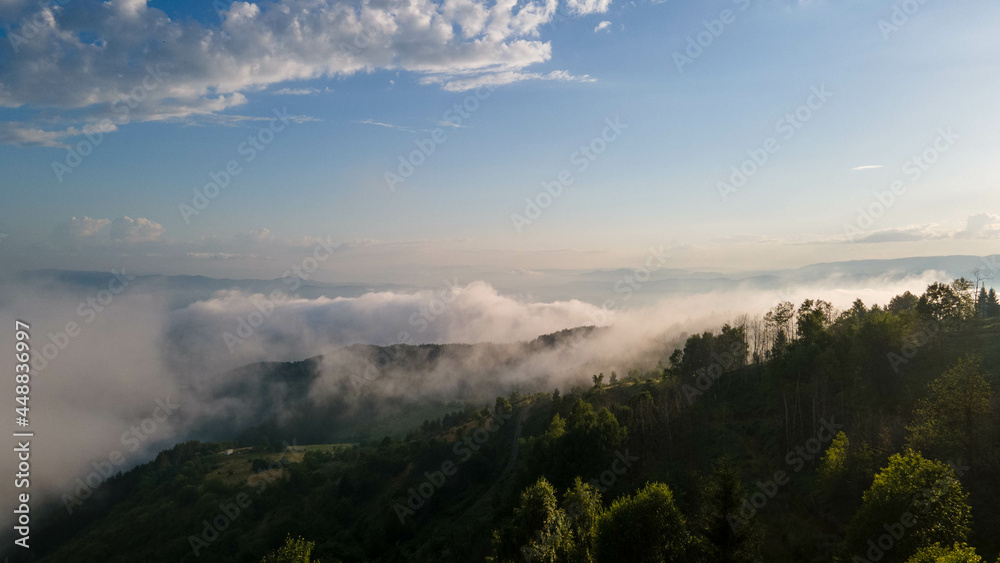 Wonderful alpine scenery with great rocks and mountains in dense low clouds. Atmospheric highlands landscape with mountain tops above clouds. Wonderful alpine scenery with great rocks and mountains in dense low clouds. Atmospheric highlands landscape with mountain tops above clouds.