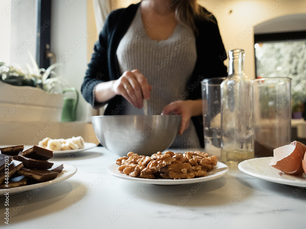 Woman cooking a chocolate cake in kitchen