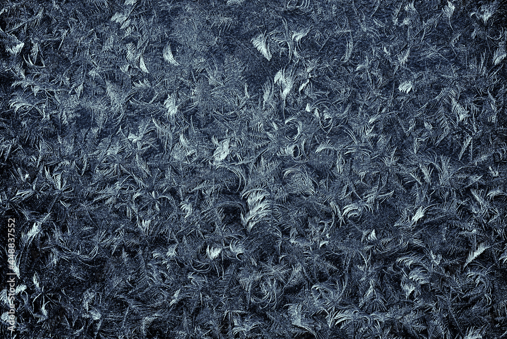Abstract full frame background of an artificial frost pattern. Abstract pattern of natural ice. Toned image. Abstract full frame background of an artificial frost pattern. Abstract pattern of natural ice. Toned image.