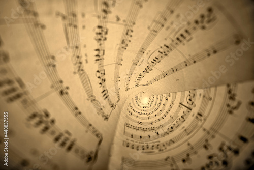 View inside a cone from a music score sheet. Sepia toned.