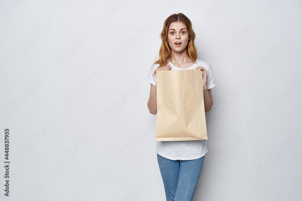 pretty woman with package of groceries shopping delivery lifestyle pretty woman with package of groceries shopping delivery lifestyle