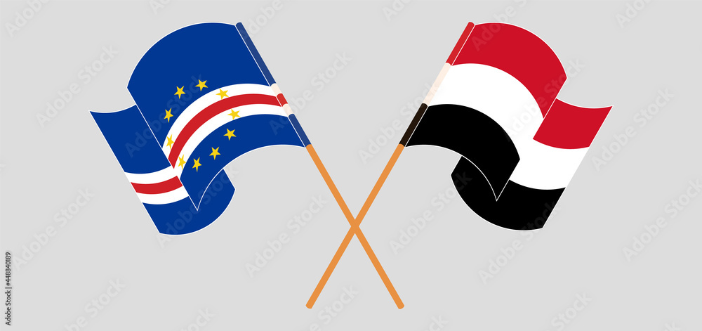 Crossed and waving flags of Cape Verde and Yemen