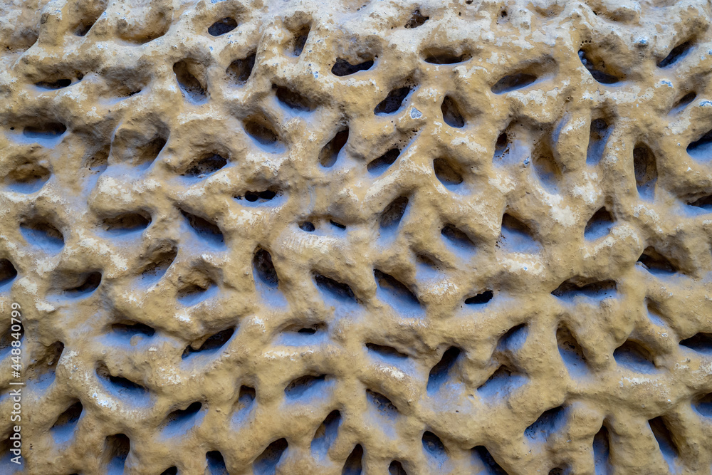 damaged weathered concrete coating of fainted paint of old building wall