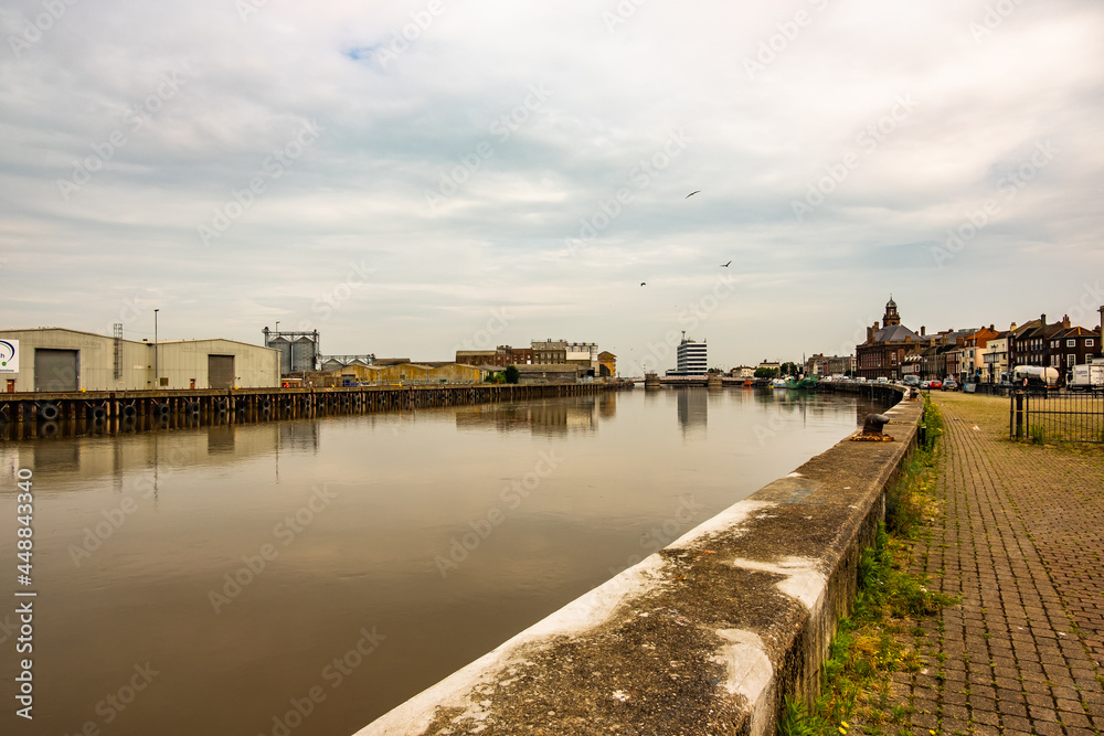 The riverside industrial area along the River Yare on a cloudy and dull day. Great Yarmouth, 2021.