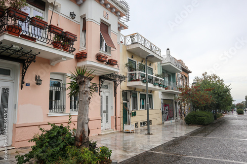 Athens  Greece - September 24  2019  Nice cozy residential traditional attica street and buildings in city downtown on a rainy day. Plaka old neighbourhood of Athens  around Acropolis