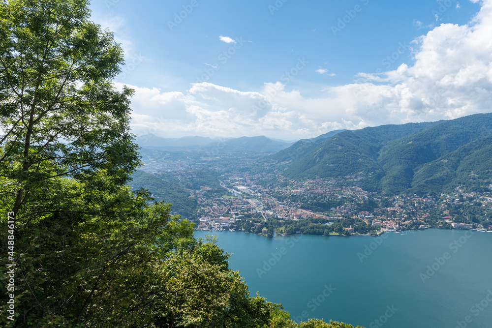 Beautiful view over Lake Como and the city of Tavernola, Lombardy, Italy. The view is seen from the small village of Brunate, above the city of Como. It is a sunny, summer day