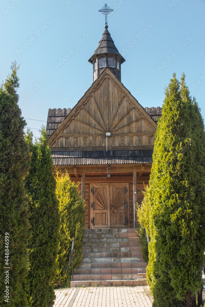 Fototapeta premium A small wooden cemetery church in Banska Wyzana in Podhale