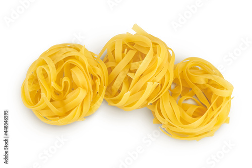 Raw tagliatelle pasta isolated on white background with clipping path and full depth of field. Top view. Flat lay