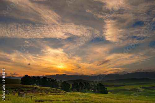 Drakensberg sunset in South Africa over fields of wheat 
