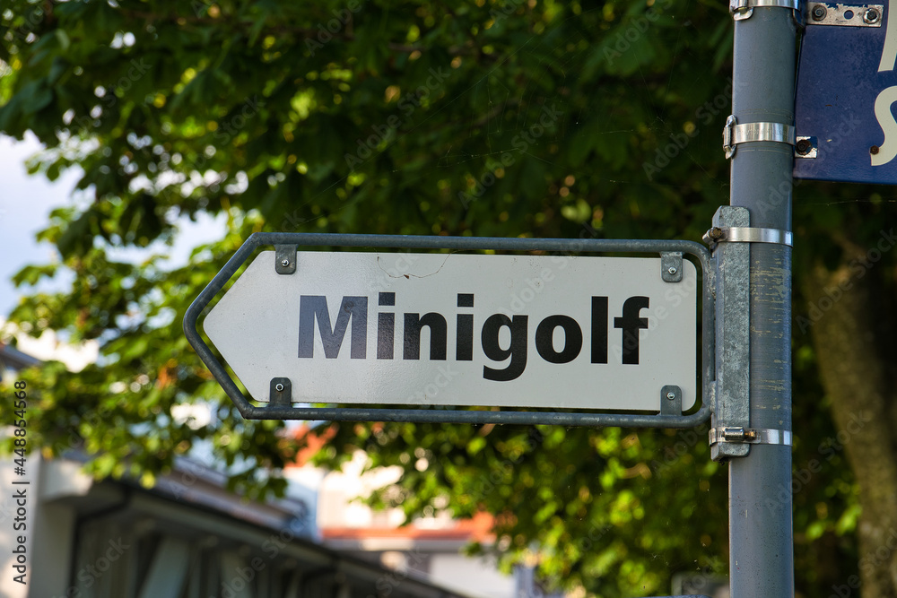 Selective focus of a signboard with minigolf text in Sempach, Switzerland  Stock Photo | Adobe Stock