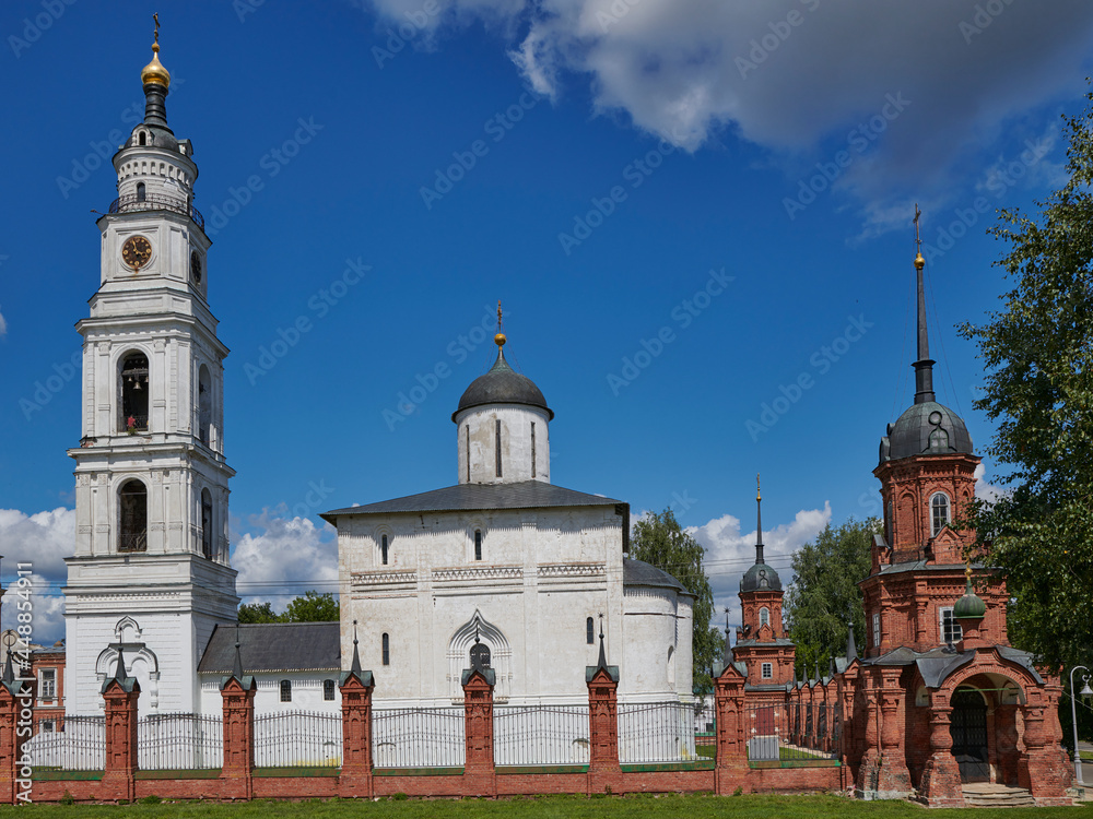 Obraz premium Russia. The town of Volokolamsk. Kremlin. View from the South. The bell tower and the Resurrection Cathedral behind the Kremlin fence. Corner Tower with Cathedral Chapel