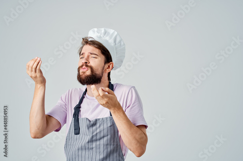 man in chef's uniform cooking restaurant kitchen professionals